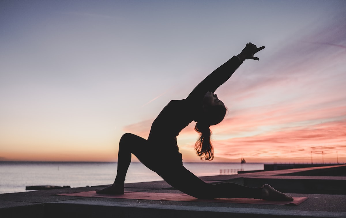 Woman practising yoga outdoors